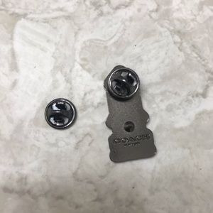 Coach spaceship enamel pin